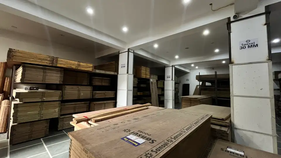 Stacks of MDF, particle and block boards stored on warehouse racks